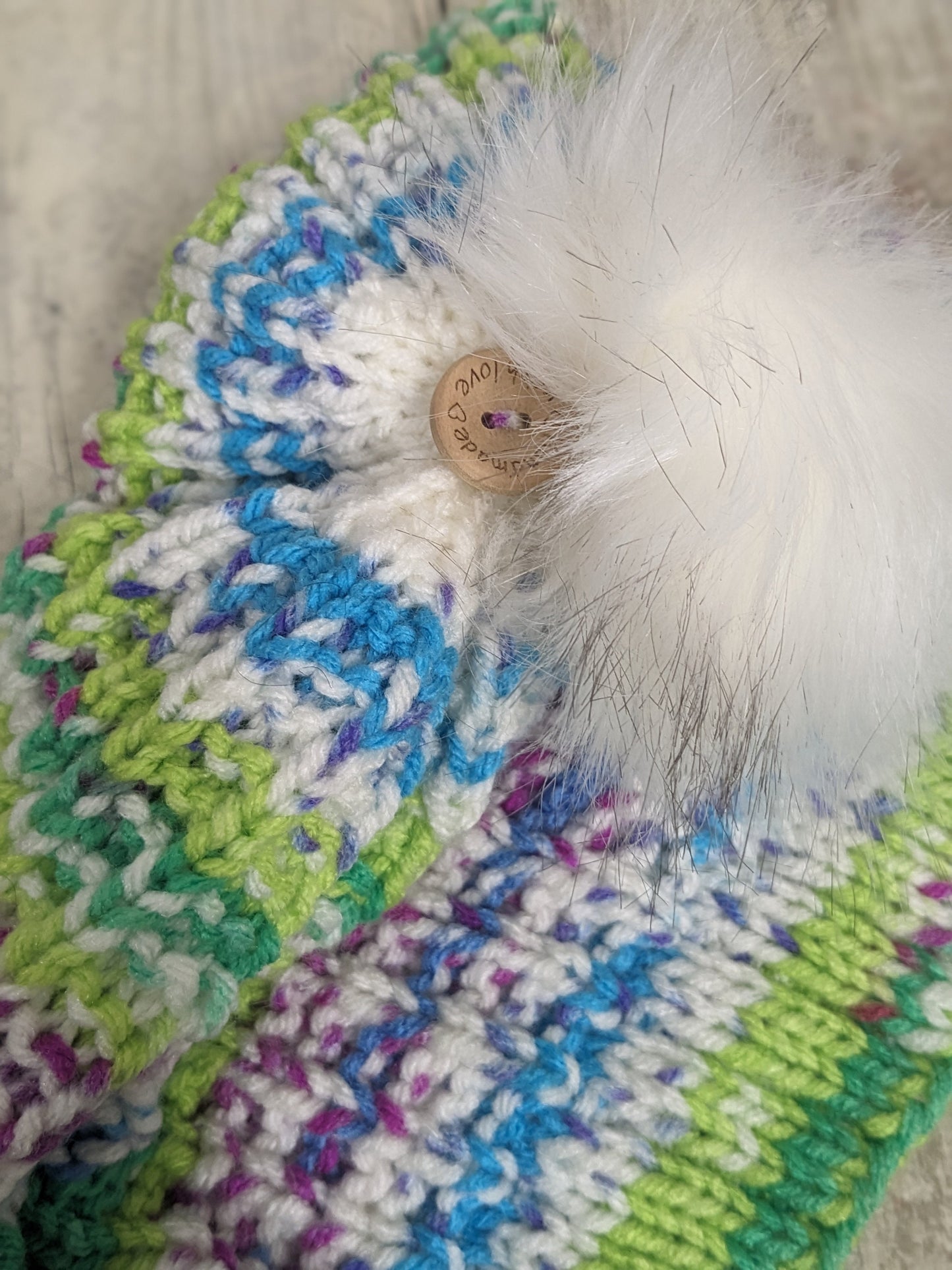 Hand knitted with love bright colours funky unique green purple blue white ribbed texture beanie bobble faux fur pompom hat #PoshTags