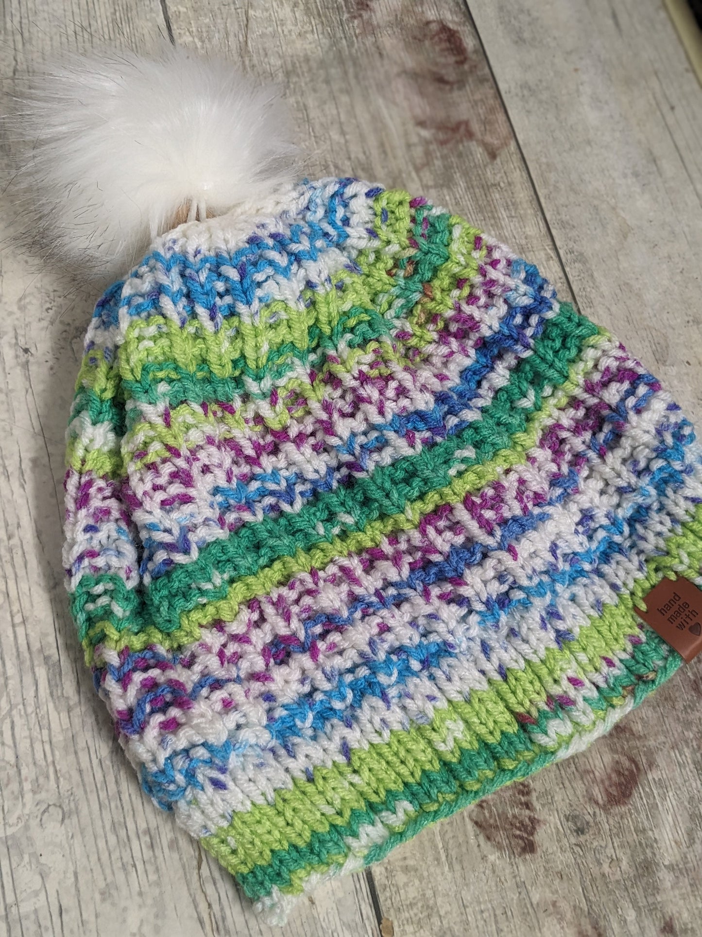 Hand knitted with love bright colours funky unique green purple blue white ribbed texture beanie bobble faux fur pompom hat #PoshTags