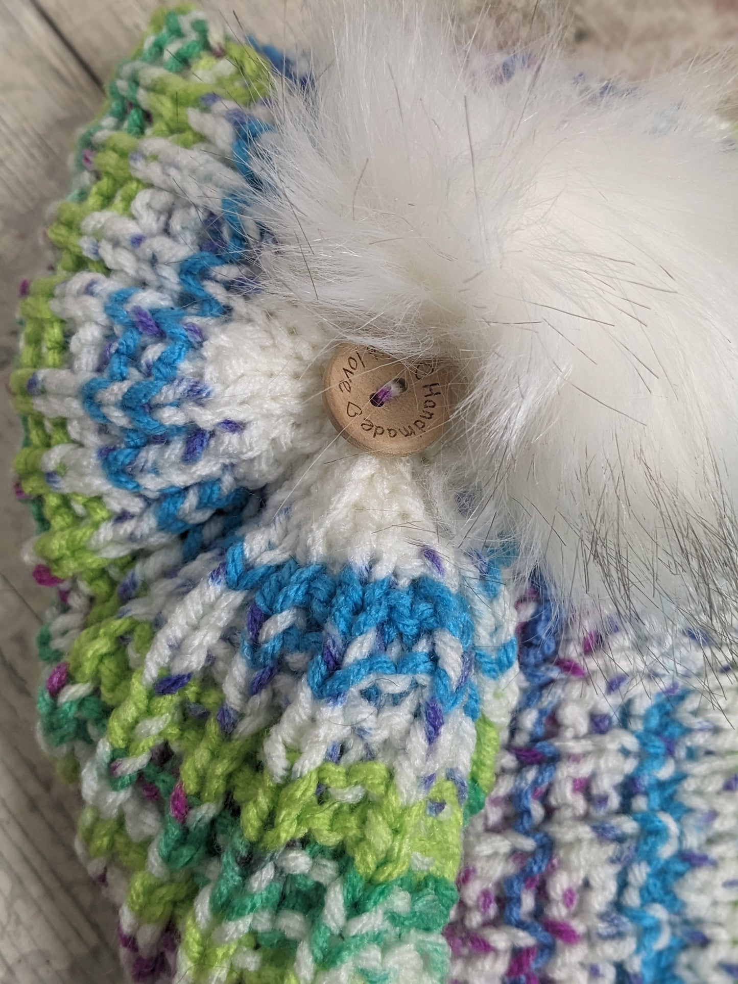 Hand knitted with love bright colours funky unique green purple blue white ribbed texture beanie bobble faux fur pompom hat #PoshTags