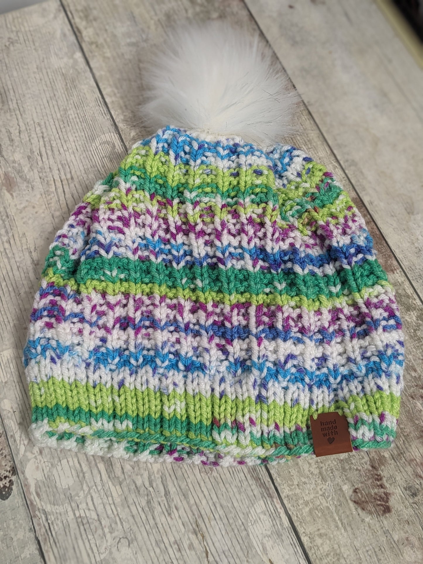 Hand knitted with love bright colours funky unique green purple blue white ribbed texture beanie bobble faux fur pompom hat #PoshTags